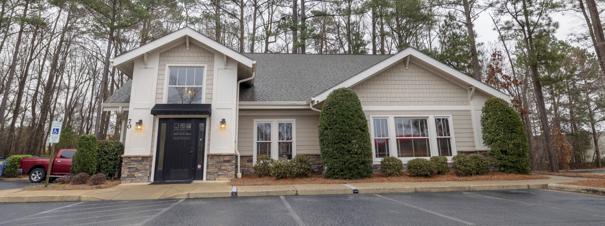 Man talking on phone with team member at dental office in Lillington