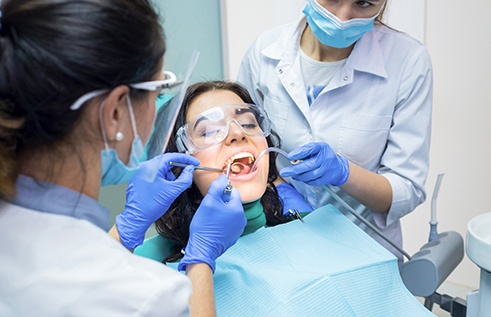 Woman undergoing dental treatment